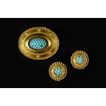 A VICTORIAN TURQUOISE PANEL BROOCH, the oval panel highlighted with a cluster of turquoise