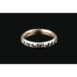 AN EARLY 19TH CENTURY DIAMOND FULL HOOP ETERNITY RING, set throughout with cushion-shaped old-cut