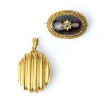 A VICTORIAN LOCKET PENDANT, the hinged oval locket of fluted design, with ropetwist wirework