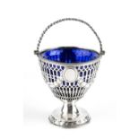 A GEORGE III SILVER SWING HANDLED SUGAR BASKET, pierce decorated and embossed with swags, on