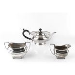 A SILVER TEAPOT, of compressed circular form, with beaded border, and ebonised handle and knop, by