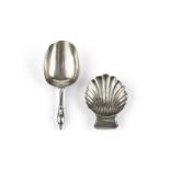 A 19TH CENTURY RUSSIAN SILVER CADDY SPOON, and another caddy spoon of scallop form, with import