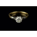 A DIAMOND SINGLE STONE RING, the round brilliant-cut diamond in claw setting, two colour precious