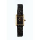 A LADY'S WRISTWATCH BY GRAFF, the rectangular black dial with gilt signature and hands, to a