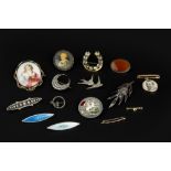 A COLLECTION OF BROOCHES, to include two navette-shaped enamel panel brooches, each stamped '