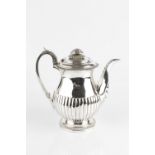 A GEORGE III SILVER TEAPOT, of half lobed baluster form, on gadrooned foot, by Rebecca Emes & Edward