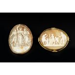TWO OVAL SHELL CAMEO BROOCHES, the first carved to depict Vulcan's Forge, to a foliate decorated