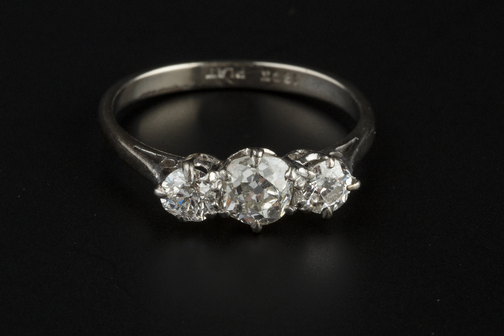 A DIAMOND THREE STONE RING, the graduated old-cut diamonds in claw setting, white precious metal