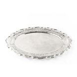 AN EDWARDIAN SILVER OVAL TWIN HANDLED TRAY, with shaped and pierce decorated border, by Walker &
