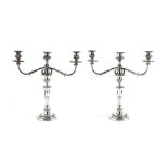 A PAIR OF 19TH CENTURY SILVER PLATED THREE LIGHT CANDELABRA, with gadrooned borders, half lobed