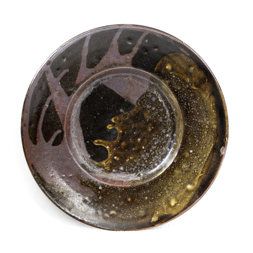 Leach School Charger tenmoku splashed glaze indistinct impressed potter's seal 34cm diameter.