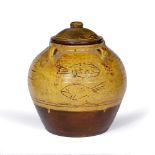 Michael Cardew (1901-1983) at Winchcombe Pottery Jar and cover slipware, decorated with fish, with