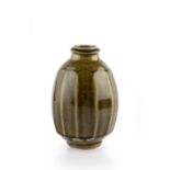 Phil Rogers (b.1951) Vase green glaze, faceted sides impressed potter's seal 17cm high.