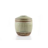 Richard Batterham (b.1936) Jar and cover green ash glaze, fluted sides painted mark 12.5cm high.