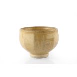 Jim Malone (b.1946) Footed bowl ochre glaze, cut sides impressed potter's and pottery seals 9.5cm