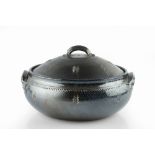 Toff Milway (b.1949) Casserole dish blue glaze, with incised sprigs signed 34cm across.