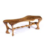 Mid-Century Design Table yew wood, with carved supports 41cm high, 123cm wide.