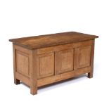 Workshop of Peter Waals (1870-1937) Blanket box oak, with panelled front on square cut legs 45cm