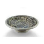 Ruthanne Tudball (b.1948) Footed charger soda glaze impressed potter`s seal 37cm diameter.