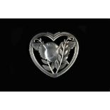 Arno Malinowski (Danish, 1899 - 1976) for Georg Jensen Silver brooch openwork heart enclosing a bird