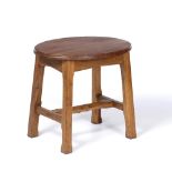 Manner of Arthur Romney Green (1872-1945) Stool, circa 1920 oak, the oval top over carved legs and