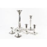 A SILVER CANDLESTICK, of corinthian column design, on square stepped base, London 1963, 30cm high; a