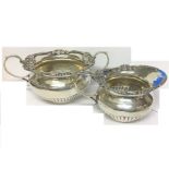 A LATE VICTORIAN SILVER MILK JUG AND SUGAR BASIN, the gadrooned borders cast with scallops and