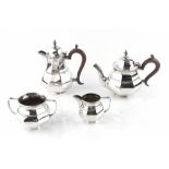 A SILVER FOUR PIECE BACHELOR'S TEA SERVICE, of octagonal faceted baluster design, the teapot and hot