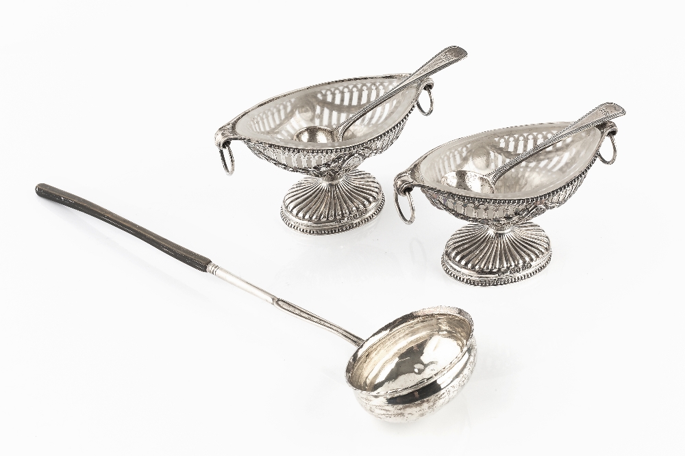 A PAIR OF MID VICTORIAN SILVER NAVETTE SHAPED PEDESTAL SALTS, the pierce decorated sides with