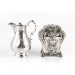 A LATE VICTORIAN SILVER TEA CADDY, of shaped rectangular baluster form, repoussé decorated with