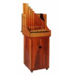 A PORTATIVE ORGAN AND STAND made by Donald Gill, the organ of traditional form with twenty five