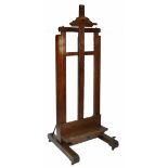 A LATE VICTORIAN ARTIST'S OAK STUDIO EASEL, the height adjustable rest operating by a turned and