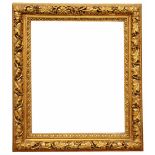 A 19TH CENTURY CONTINENTAL GILTWOOD FRAME, the border carved with fruiting vine decoration, rebate