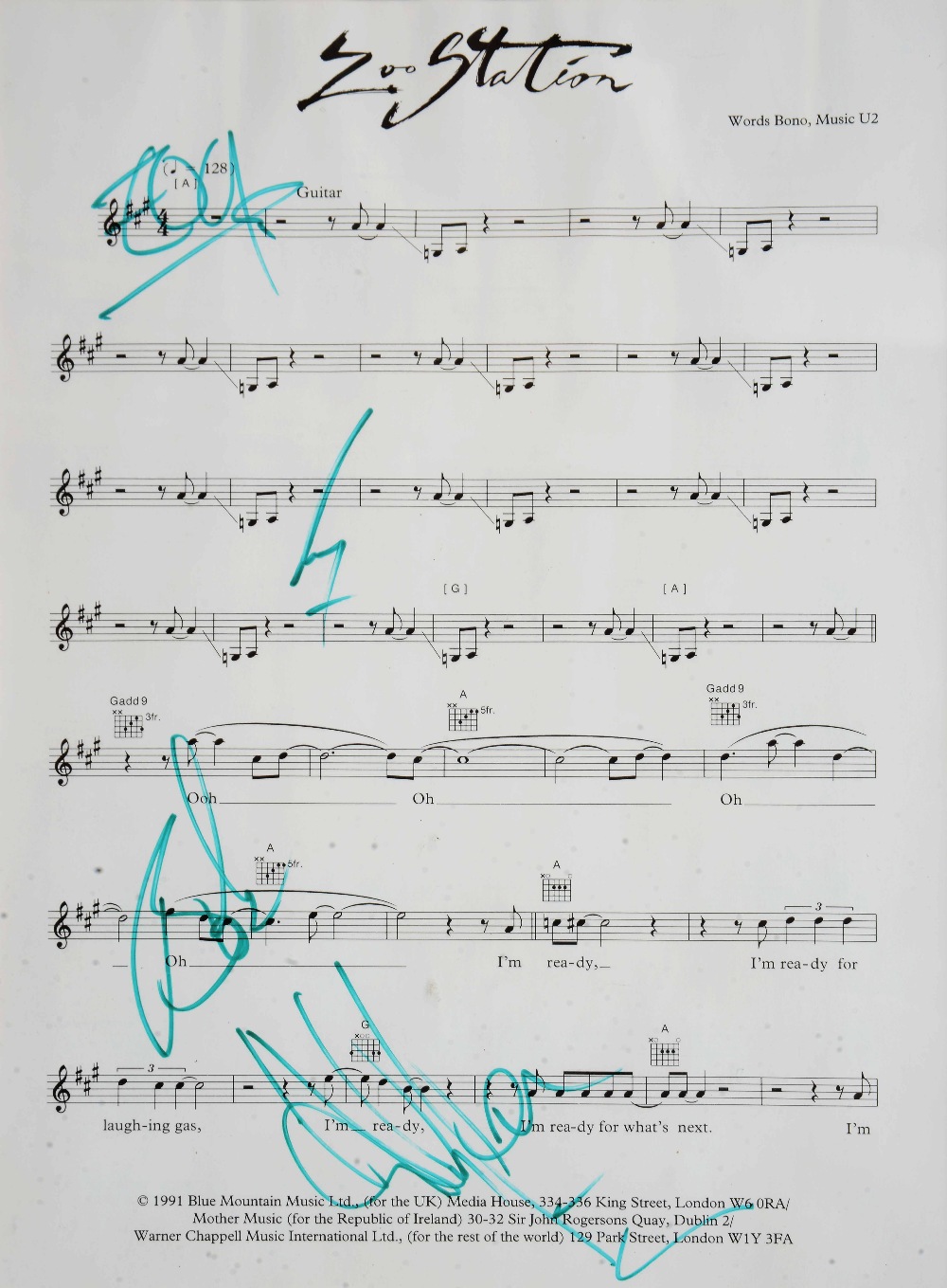 A PRINTED MUSIC SCORE for 'Zoo Station', words by Bono and music by U2, signed in green pen by