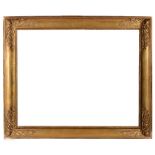 A FRENCH EMPIRE GILT AND GESSO FRAME with lamb's tongue sight and plain hollow with swan and