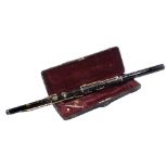 A 19TH CENTURY EIGHT KEY FLUTE in original morocco leather covered case