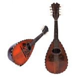 A MANDOLIN, the rosewood back with line inlay, mother of pearl and tortoiseshell decorated sound