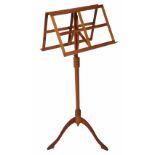A WOODEN DUET MUSIC STAND made by Donald Gill with height adjustable mechanism and turned column,