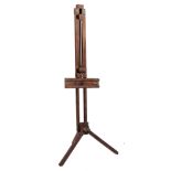 AN OAK EASEL of typical form with folding legs adjusting by an iron wing nut, approximately 186cm