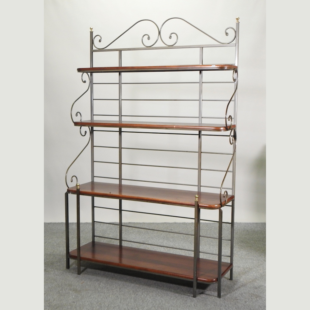 A wrought iron framed baker's rack,