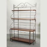 A wrought iron framed baker's rack,