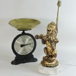 A gilt table lamp, in the form of a lion, together with a set of scales,