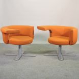 A pair of mid 20th century orange upholstered tub shaped armchairs