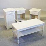 Three various cream painted pot cupboards, together with a painted coffee table,