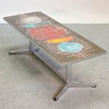 A 1960's tile top coffee table, on a metal base,