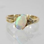 An unmarked bespoke made opal and diamond cluster ring