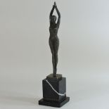 An Art Deco style bronzed figure of a lady, on a marble base,