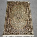 A Keshan style carpet, with floral design on a green ground,