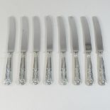 A set of eight mid 20th century silver handled table knives,