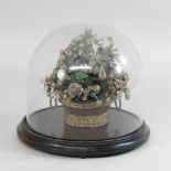 A 19th century glass dome, containing a polished stone basket of flowers,